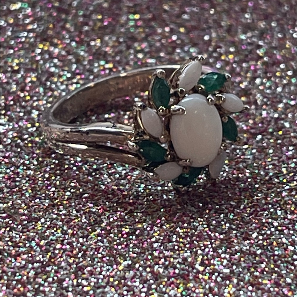 Sterling silver ring with green and white stones.